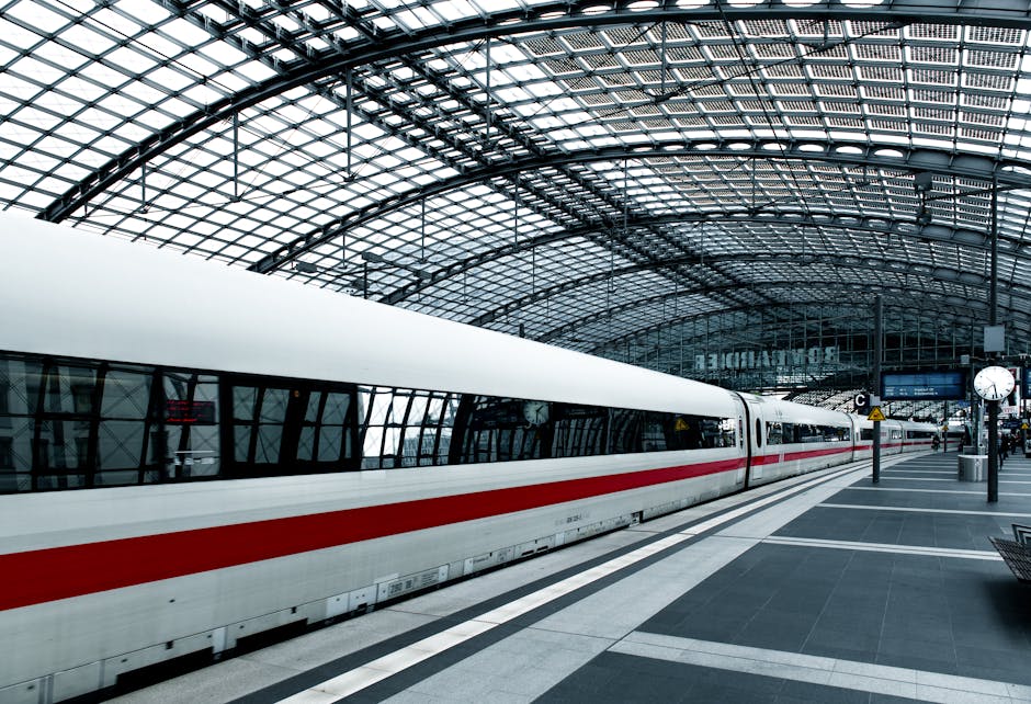 Sleek modern train in Berlin Hauptbahnhof station showcasing transportation architecture.