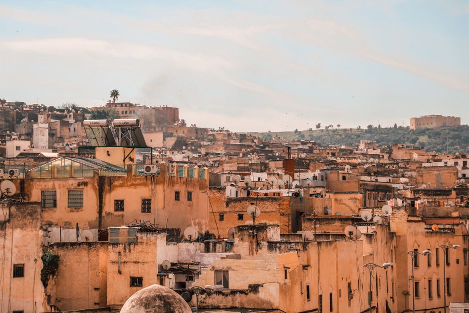 Stunning aerial view of a traditional Moroccan cityscape under a bright sky.