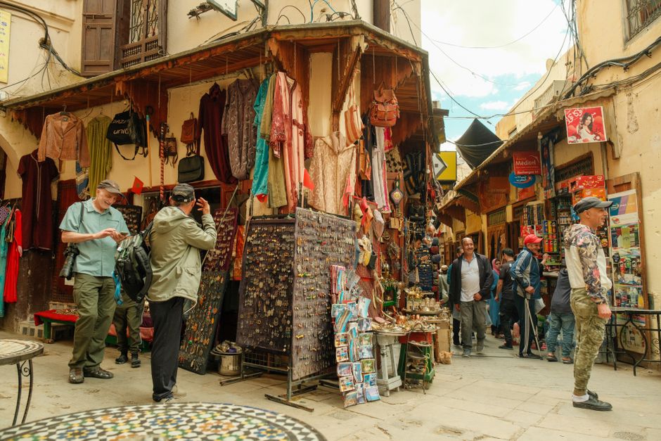 Shoppers in a narrow souk lane in the Marrakech medina