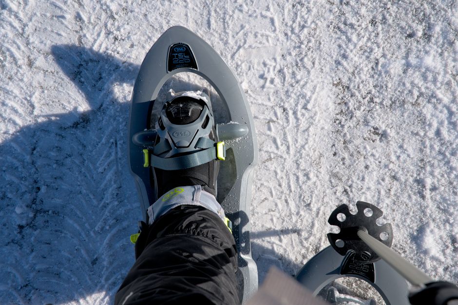 Close-up of a snowshoe on snowy ground, ideal for winter sports enthusiasts.